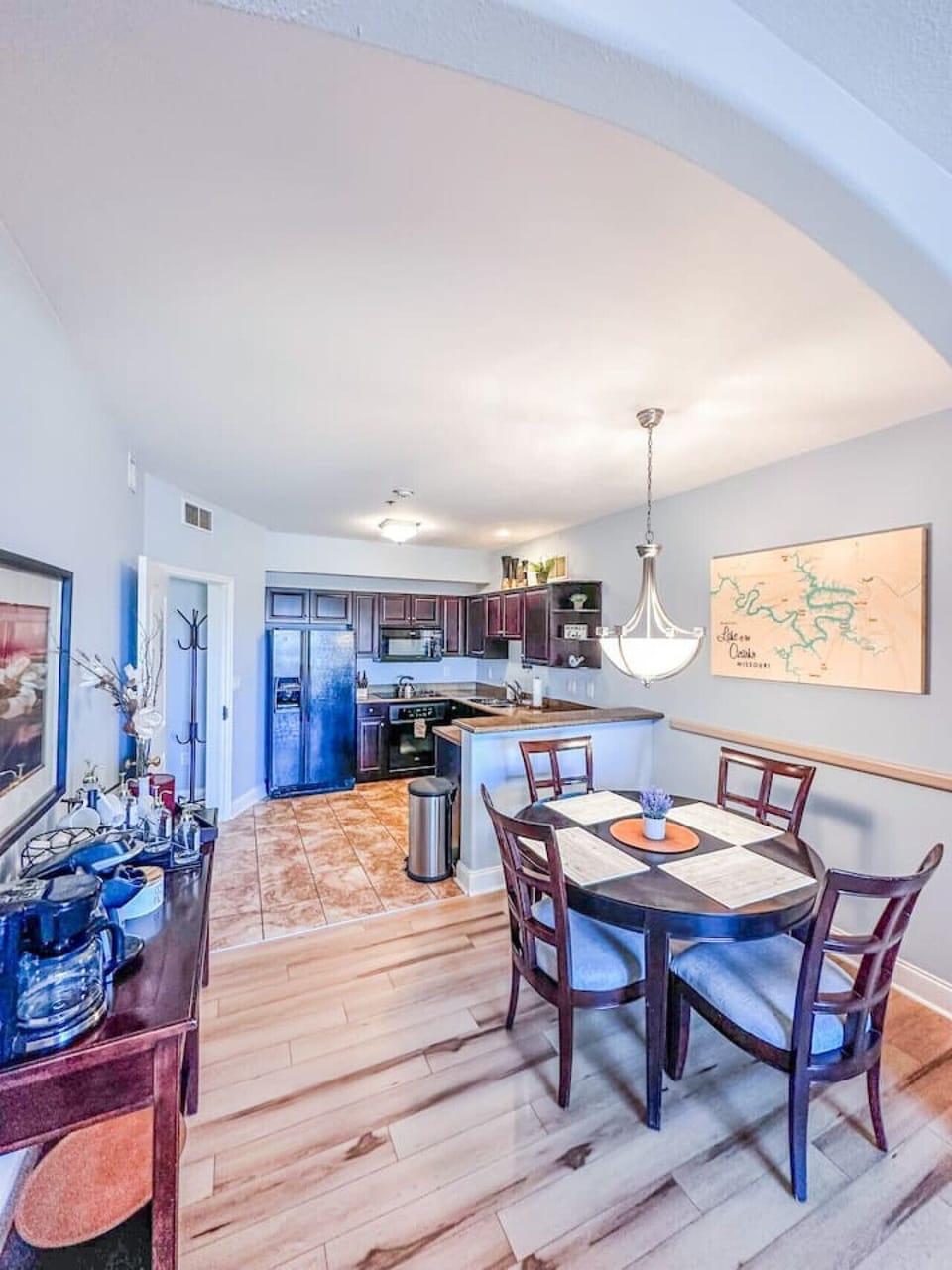 Enjoy your meals at this thoughtfully designed dining space, complete with warm lighting and a stunning map of the local area.