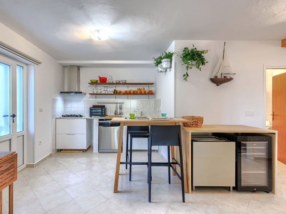 Furniture, Interior Design, Kitchen, Countertop, Flooring, Kitchen Appliance, Wood, Major Appliance, Chair, Ceiling