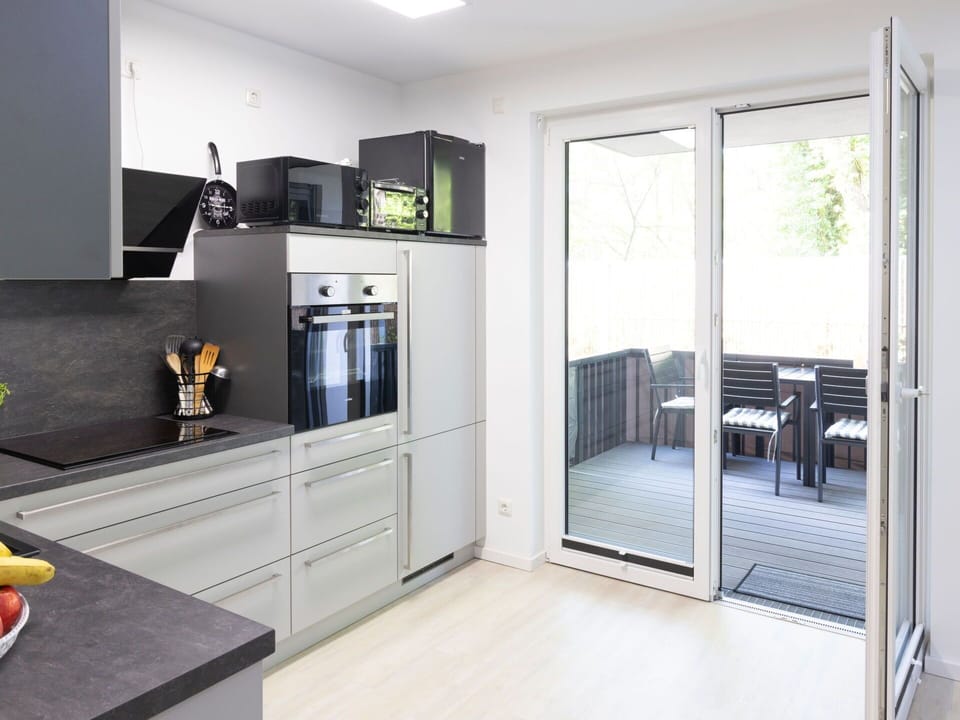 Flooring, Interior Design, Kitchen, Countertop, Floor, Wood, Furniture, Cabinetry, Kitchen Appliance, Home