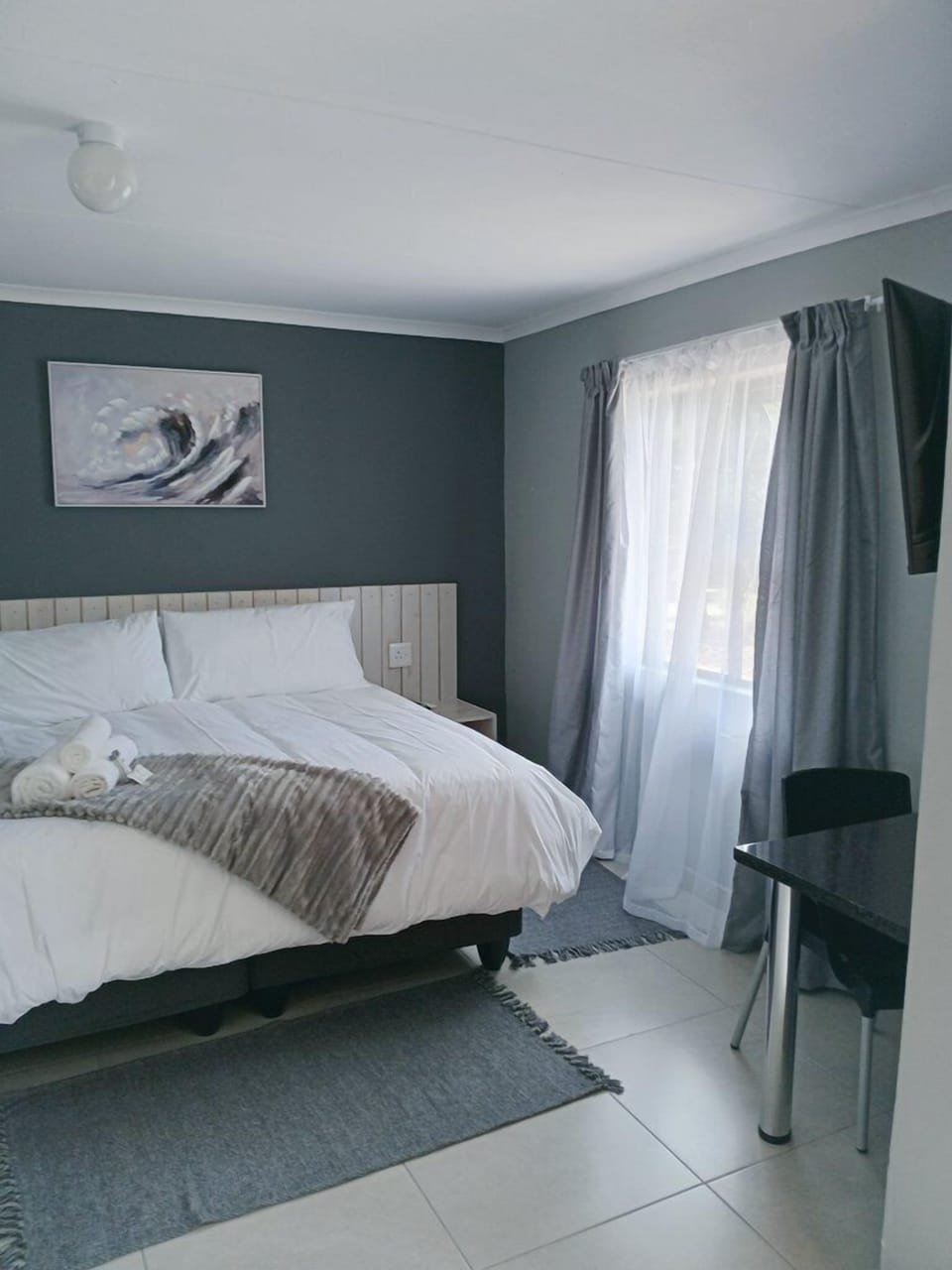 Comfort Room | Desk, laptop workspace, blackout drapes, iron/ironing board (on request)