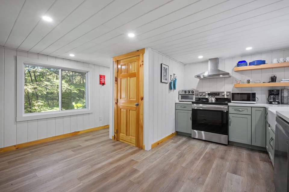 Kitchen. Note the door which is a pantry that contains a charger for your car.