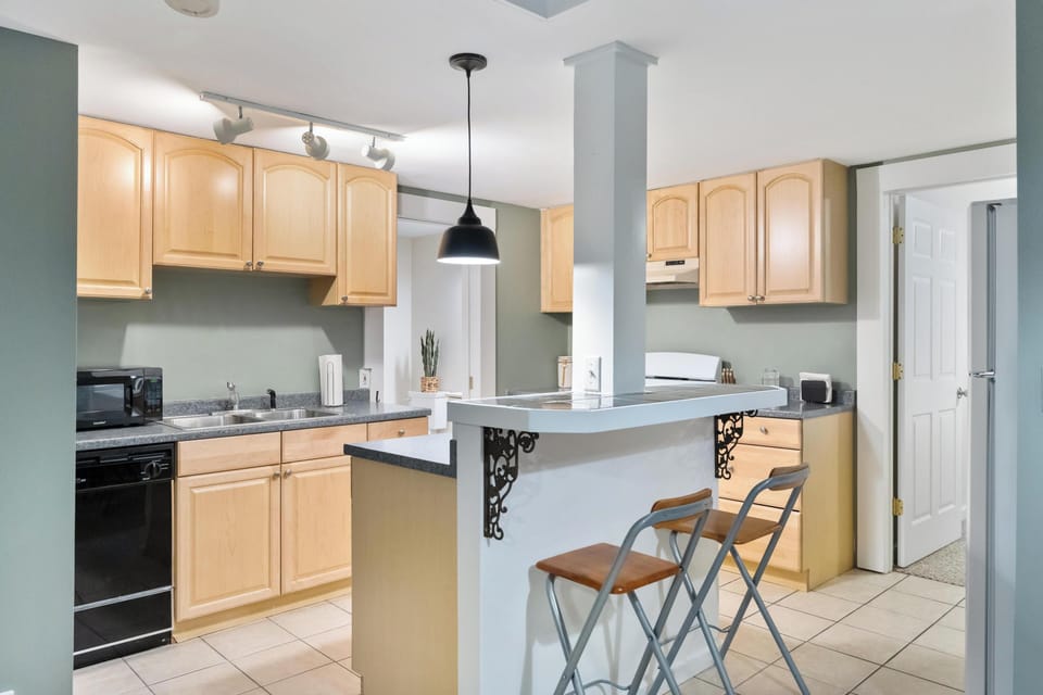 Fully equipped lower level kitchen with full-sized stove and refrigerator 