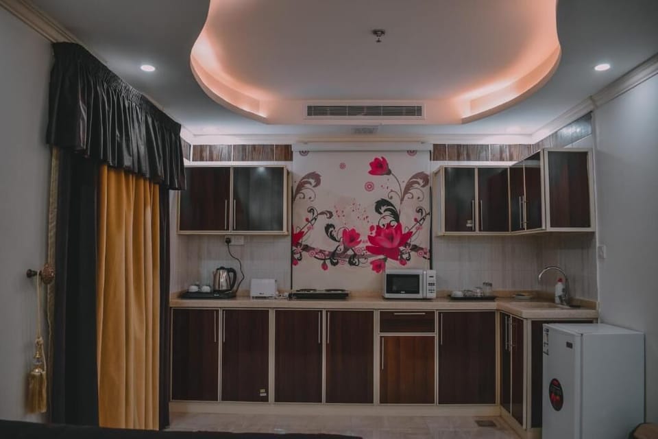 Family Apartment | Private kitchen | Mini-fridge, cookware/dishes/utensils, cleaning supplies