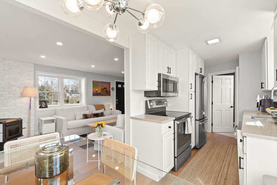 Effortless Living: The spacious design, cozy wood stove, and direct deck access make this the perfect spot for both comfort and connection.