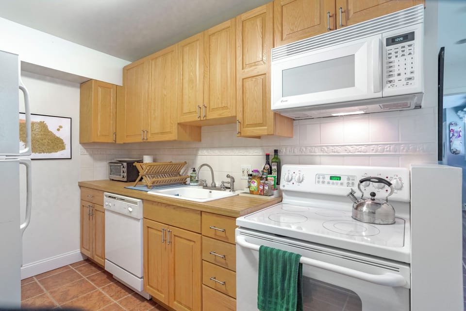 Primary Kitchen with dishwasher, microwave, toaster, oven and stove