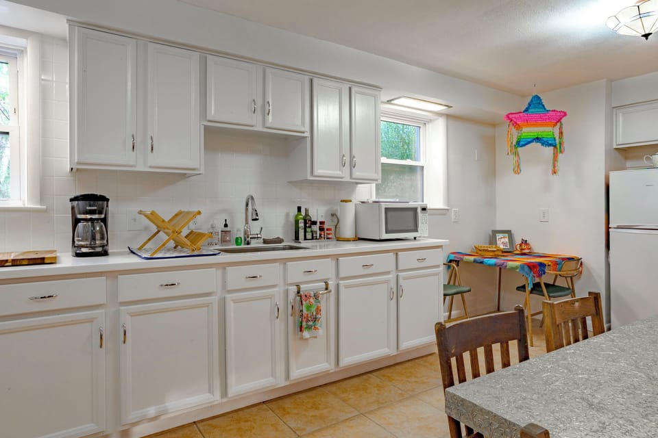 Secondary Kitchen with table for 6,  full-size fridge, microwave, coffee bar