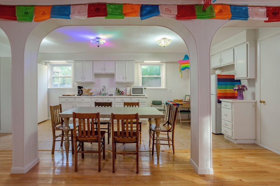 Secondary Kitchen with table for 6,  full-size fridge, microwave, coffee bar