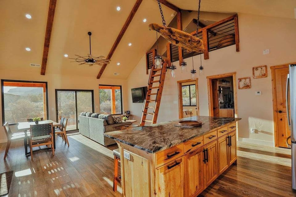 Casa Vermillion open concept Living, Dining, and Kitchen with access to the loft