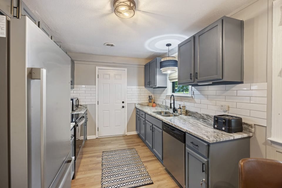 Stainless steel appliances in a fully stocked kitchen