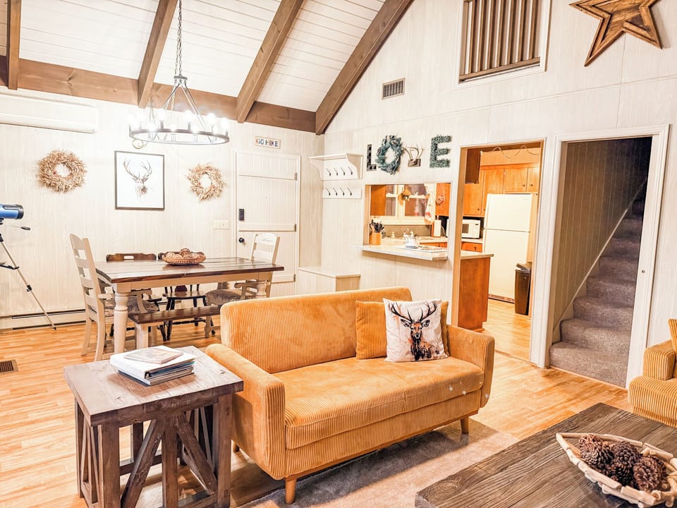 Living area with comfortable furniture, cozy gas fireplace and large smart tv.