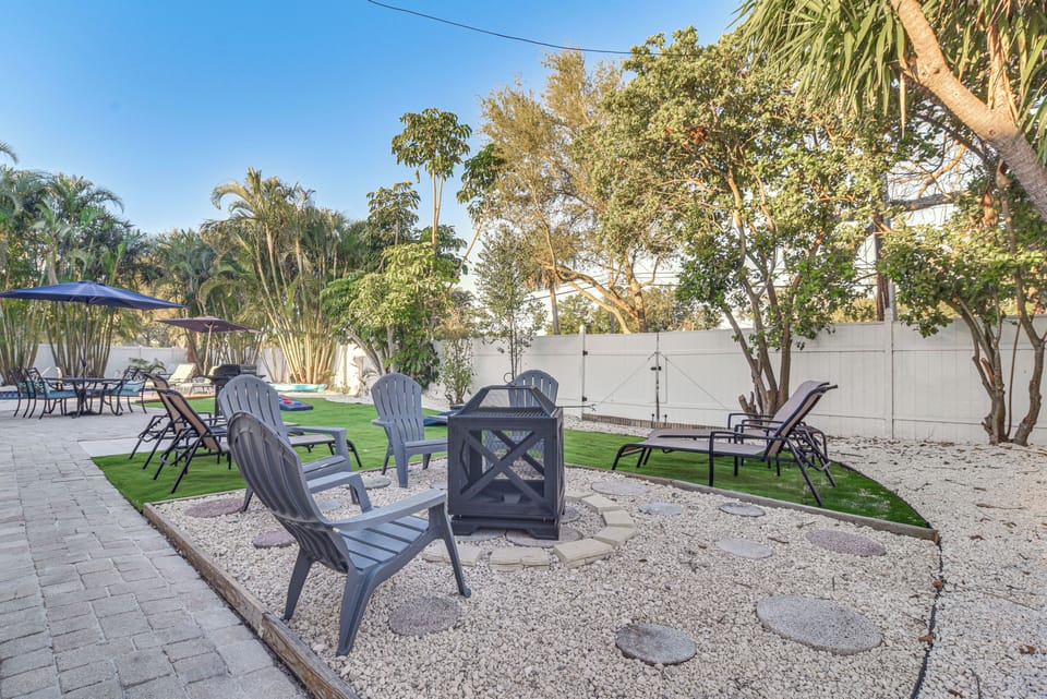 House Exterior | Gas Fire Pit | Lounge Chairs | Cornhole | Gas Grill