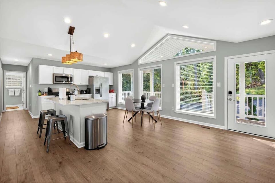 Open kitchen and dining flowing to porch with valley access