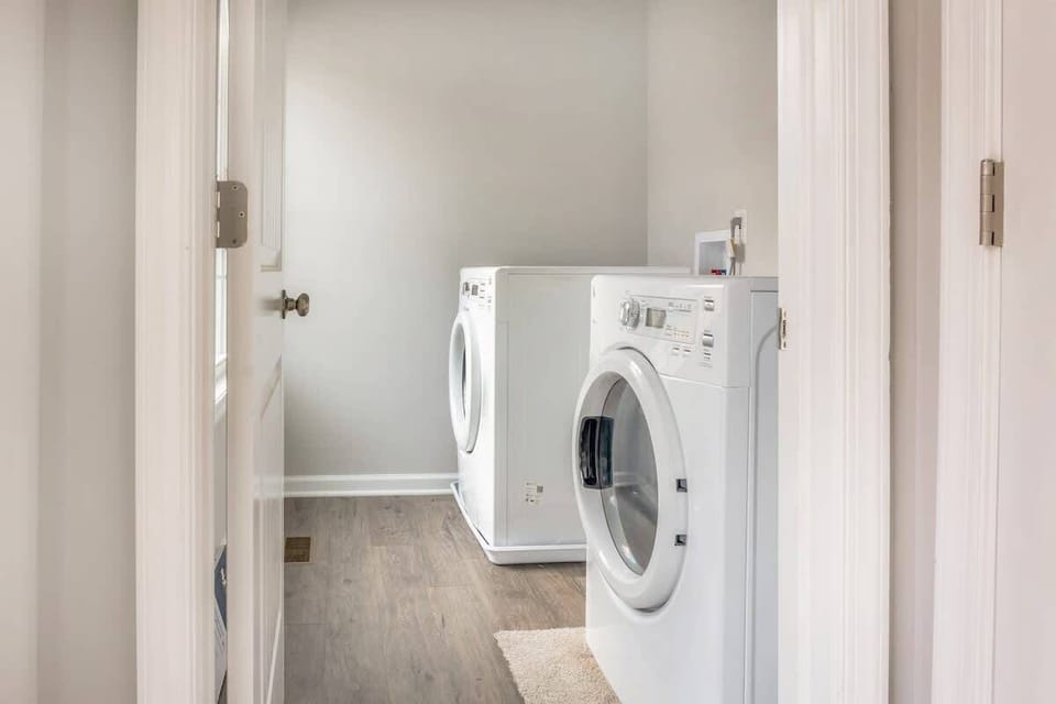 Full-size washer and dryer in the dedicated laundry room