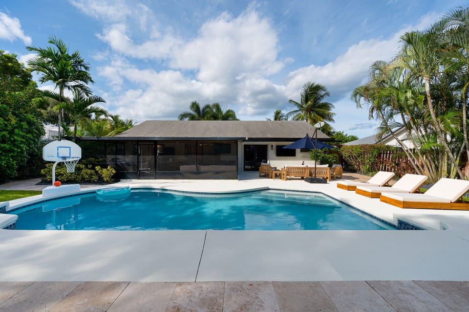 Spacious pool and deck area—perfect for lounging, sunbathing, and soaking up the Florida sunshine.