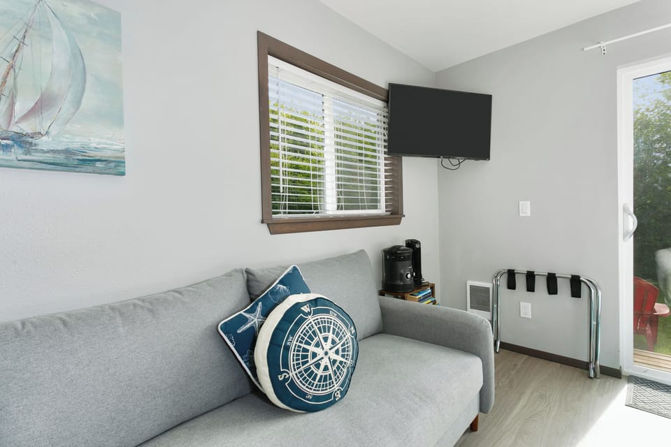 Cozy sitting area with TV and quick access to the patio