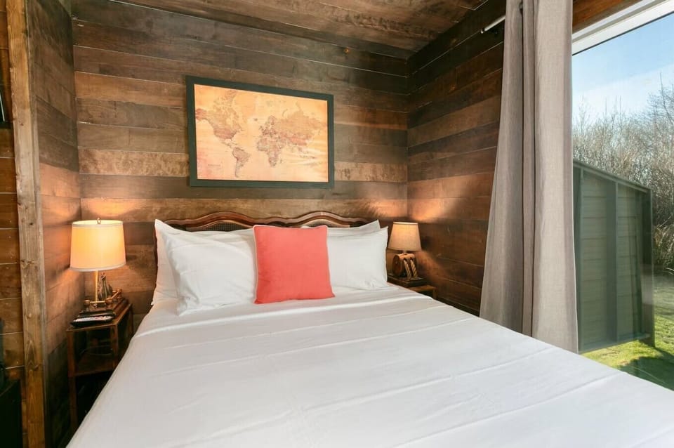 Inviting bedroom with rustic charm and peaceful outdoor views