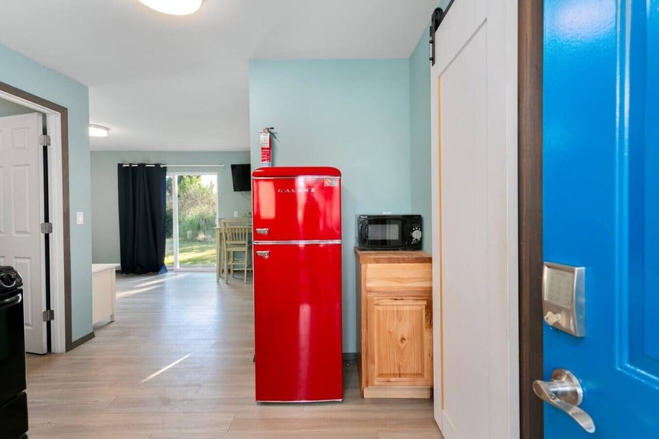 Retro fridge paired with modern comforts for a fun, cozy stay