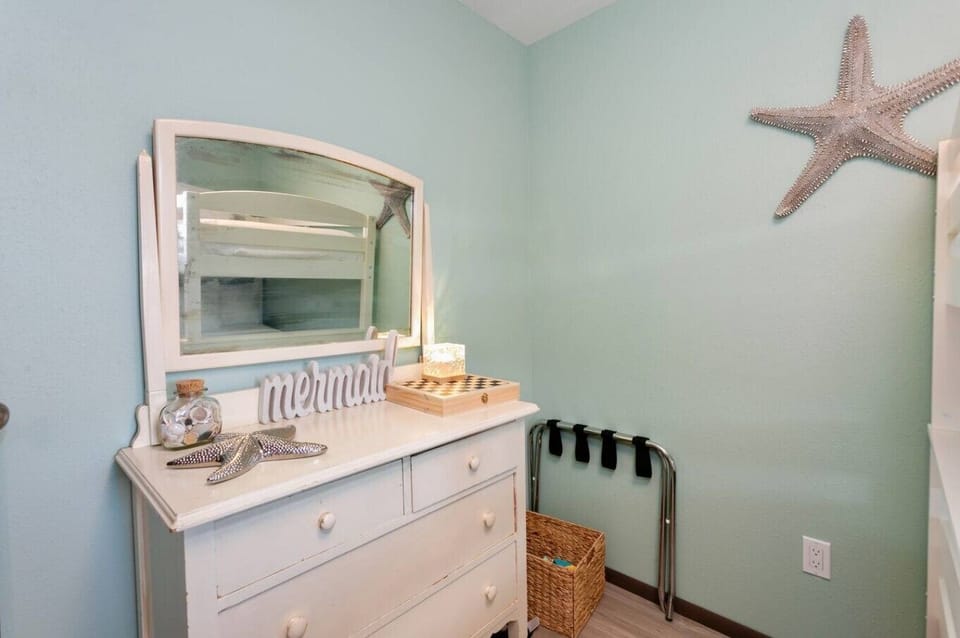 Charming vanity space with coastal touches and soft lighting