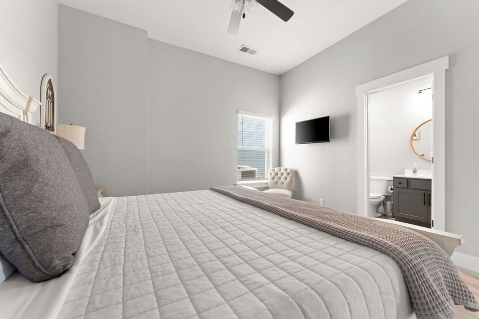 - Calming neutral tones and plush bedding create a restful retreat
- Natural light fills the space, with a window view of the lake outside
- Ensuite access and simple elegance make for easy, comfortable living