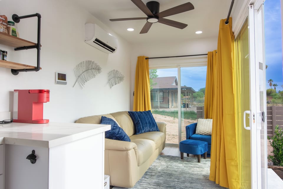Living area with ceiling fan, ac/heat