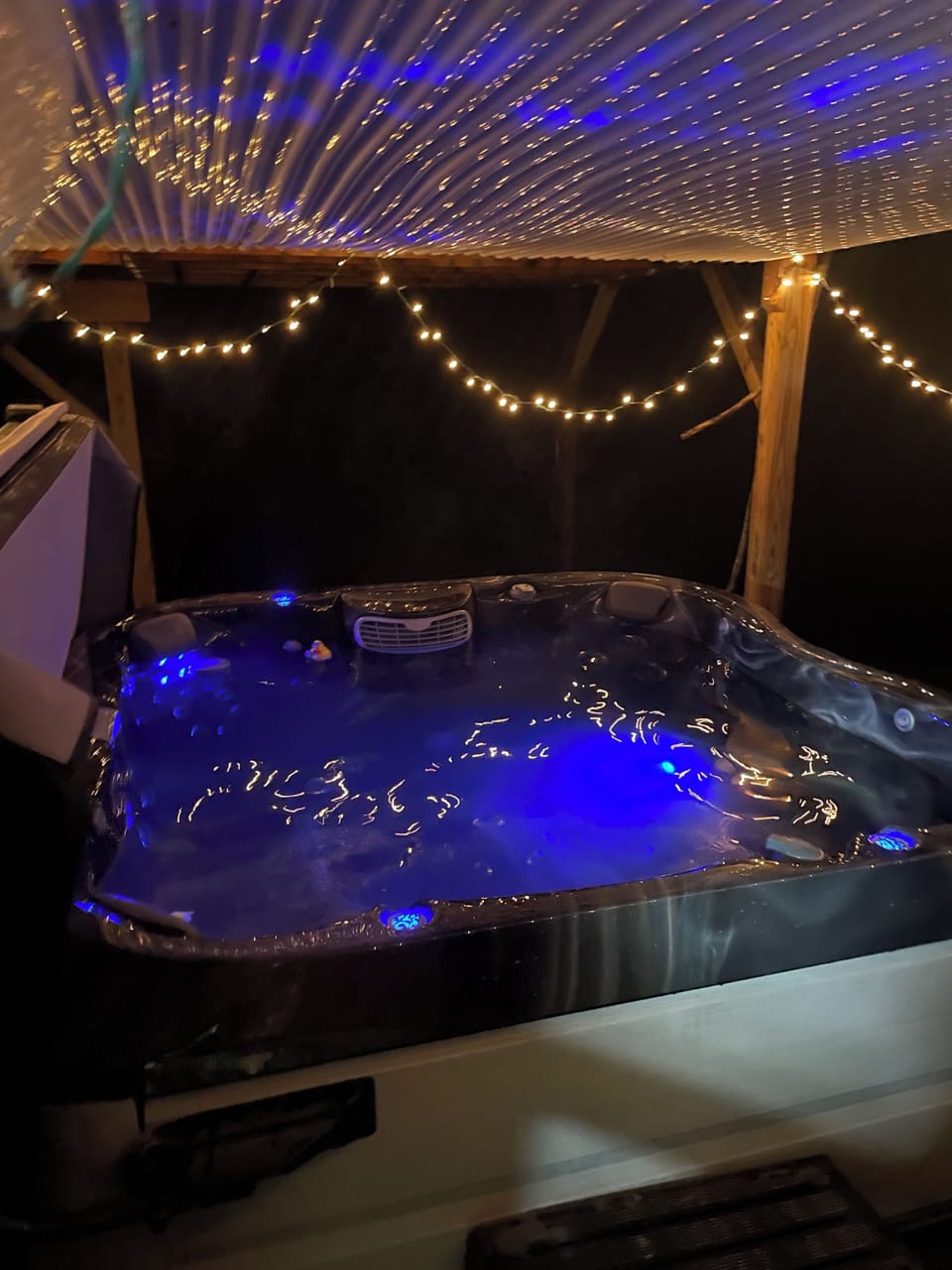 Take a relaxing soak in the hot tub with ambient lighting