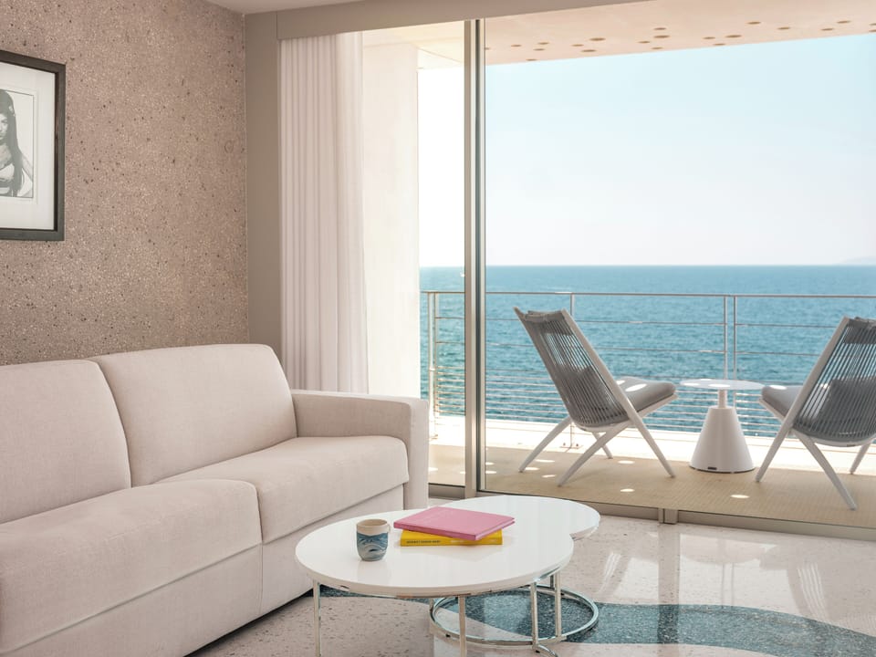 Prestige Suite, 1 king-size bed and 1 sofa bed, balcony, sea view | Living area | 90-cm flat-screen TV with cable channels