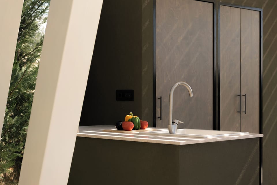 Bespoke outdoor BBQsettings featuring a sink & fridge.