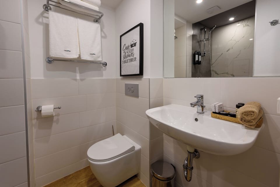 Classic Double or Twin Room | Bathroom | Shower, hair dryer, slippers, towels