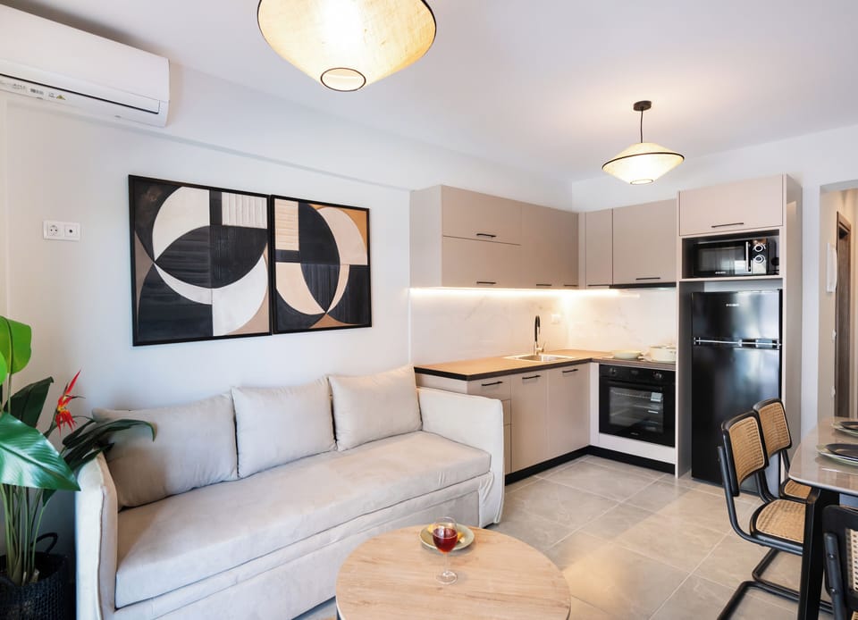 Deluxe Apartment, 1 Bedroom, Poolside | Living area | Flat-screen TV