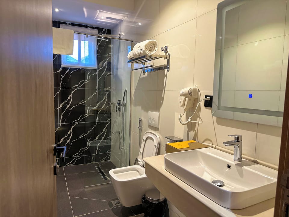 Premium Apartment, 1 Bedroom, Kitchenette | Bathroom | Hair dryer, bathrobes, slippers, bidet