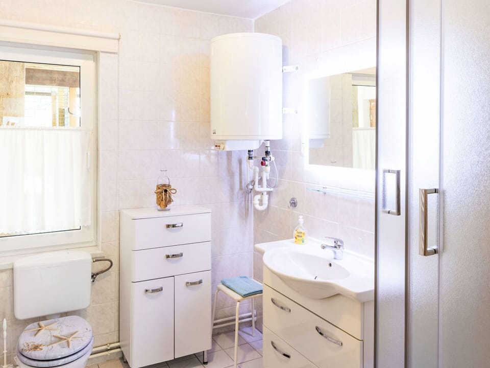 Interior Design, Plumbing Fixture, Bathroom Cabinet, Flooring, Sink, Bathroom Sink, Floor, Plumbing, Bathroom, Cabinetry