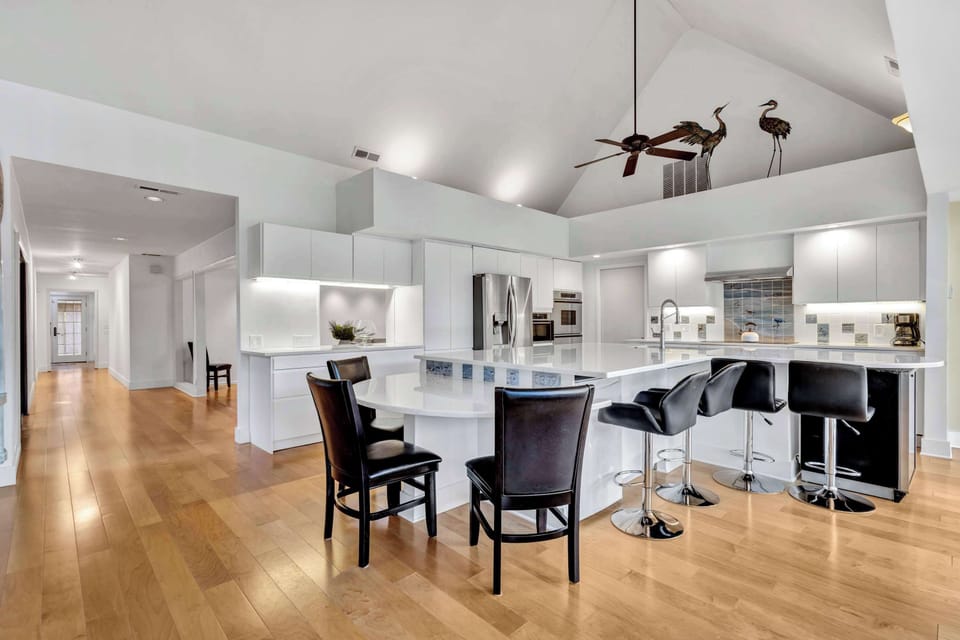 Spacious Multi-Purpose Room: A generous room with a pass-thru from the kitchen offers flexibility for dining, entertaining, or game nights.