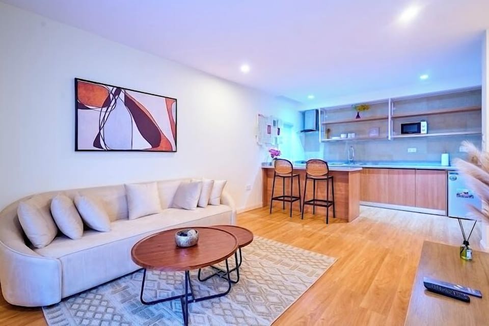 Family Apartment, Balcony, City View | Living area | Flat-screen TV