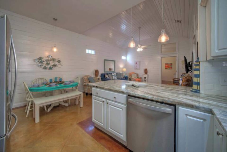 Features a large island, ample cabinetry, and high-end appliances, making it perfect for cooking, entertaining, and gathering with loved ones. 