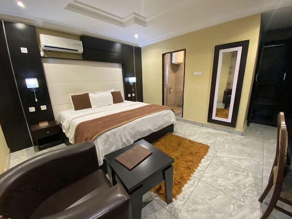 Deluxe Room, Balcony, City View | Desk, laptop workspace, blackout drapes, soundproofing