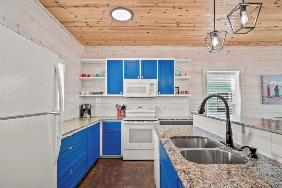 The open, airy kitchen offers ample space & all the comforts of home
