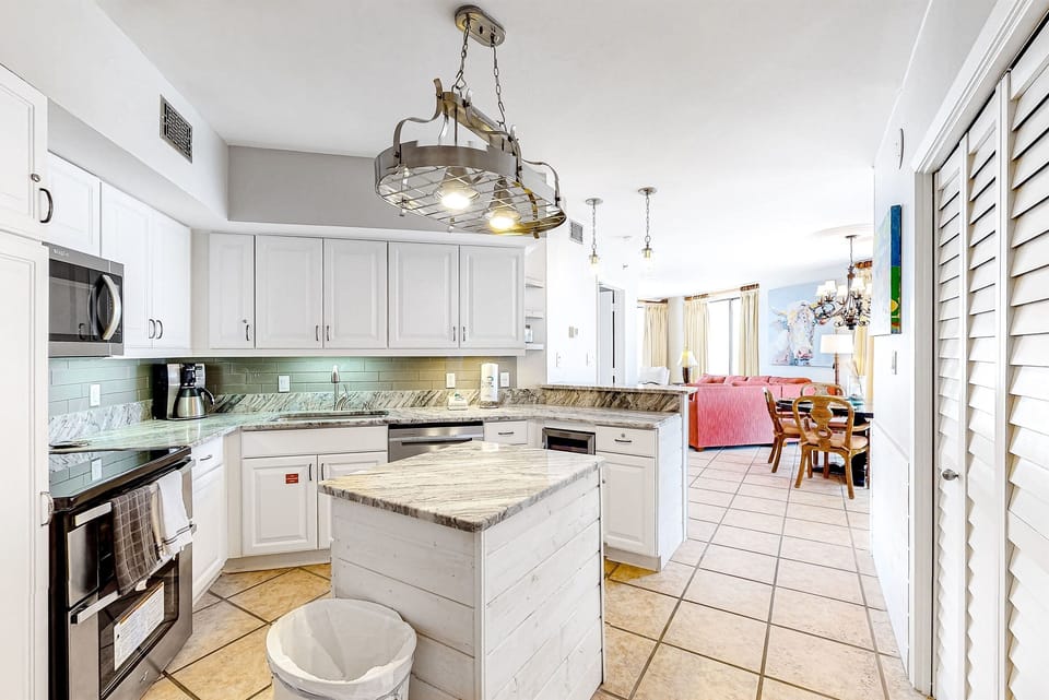 Kitchen with the perspective to the Dining and Living areas.
