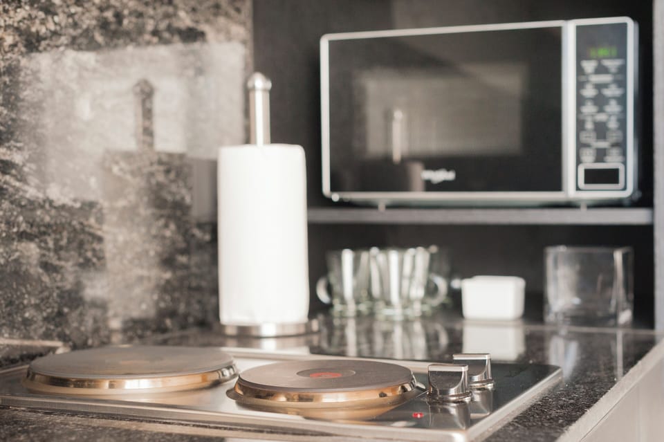 Comfort Studio, Balcony, City View | Private kitchen | Coffee/tea maker, electric kettle