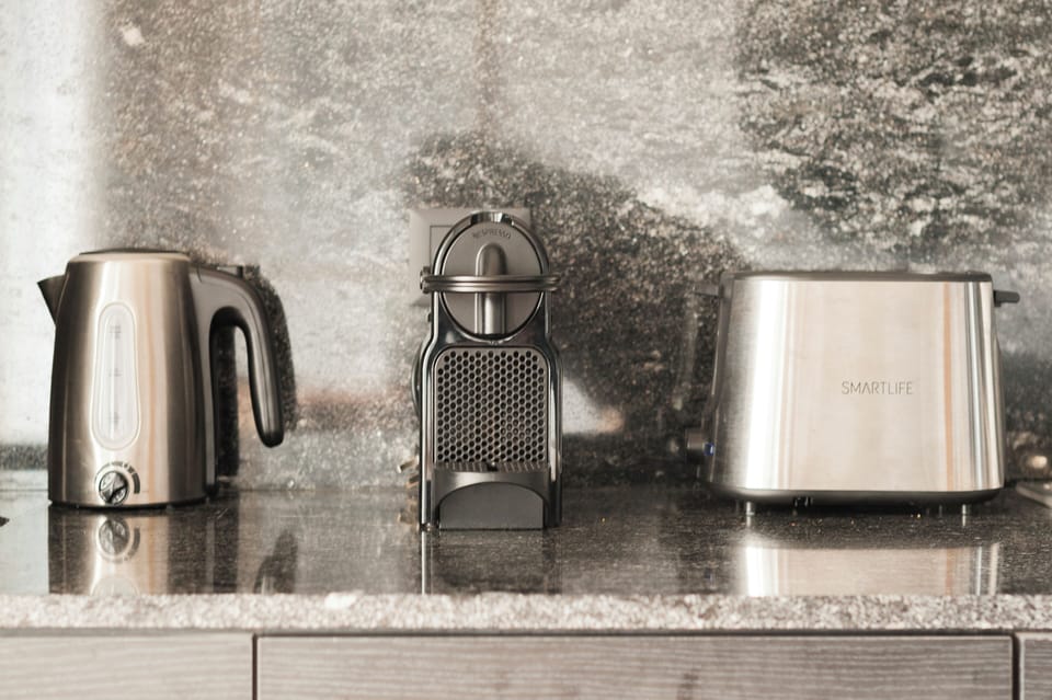 Comfort Studio, Balcony, City View | Private kitchen | Coffee/tea maker, electric kettle