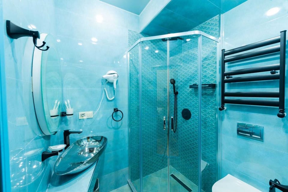 Double or Twin Room | Bathroom | Shower, hair dryer, bathrobes, slippers