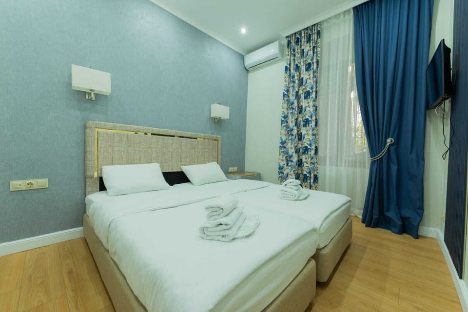 Double or Twin Room | Living area | TV, computer monitors, printers