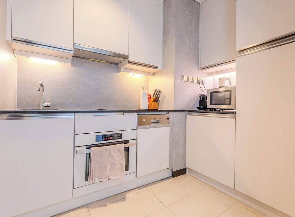 Kitchenette with stovetop, oven, washer, dishwasher, microwave, Nespresso machine, sink, kettle and all cookware, glassware and cutlery 