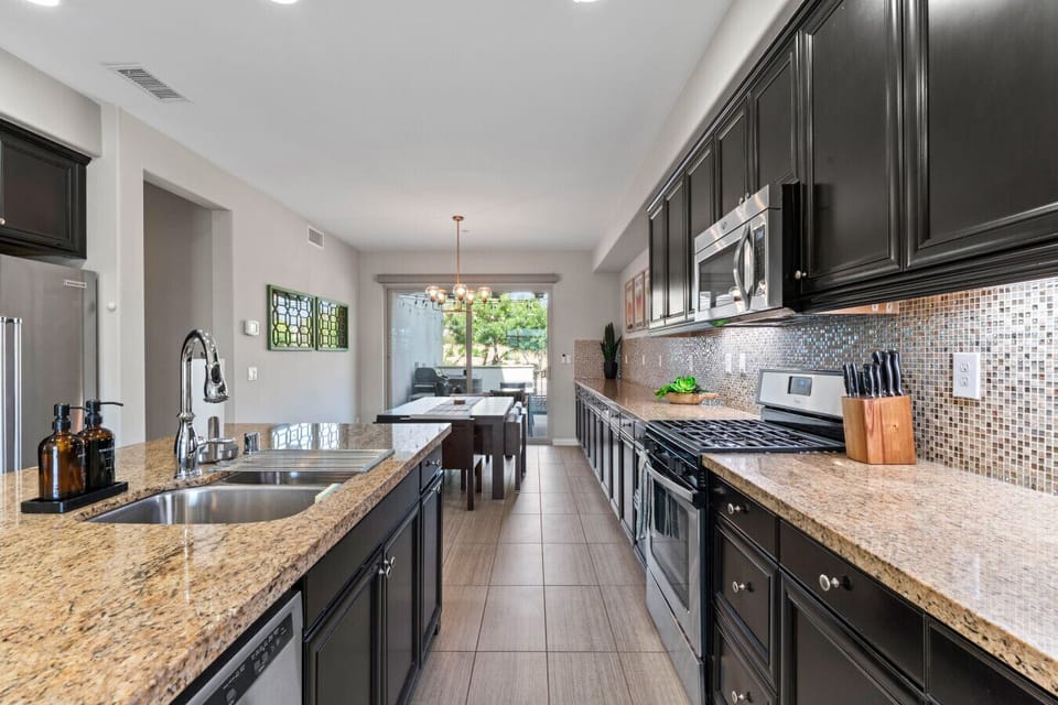 Spacious kitchen w/ long counters, stainless appliances & room to prep meals