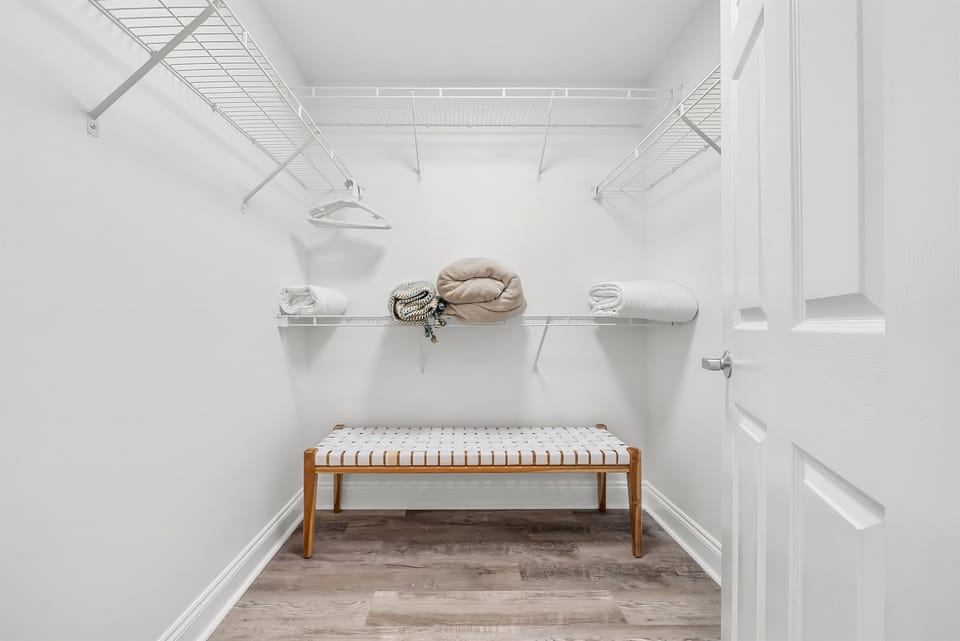 Large walk-in closet from the Primary Bedroom and Bath