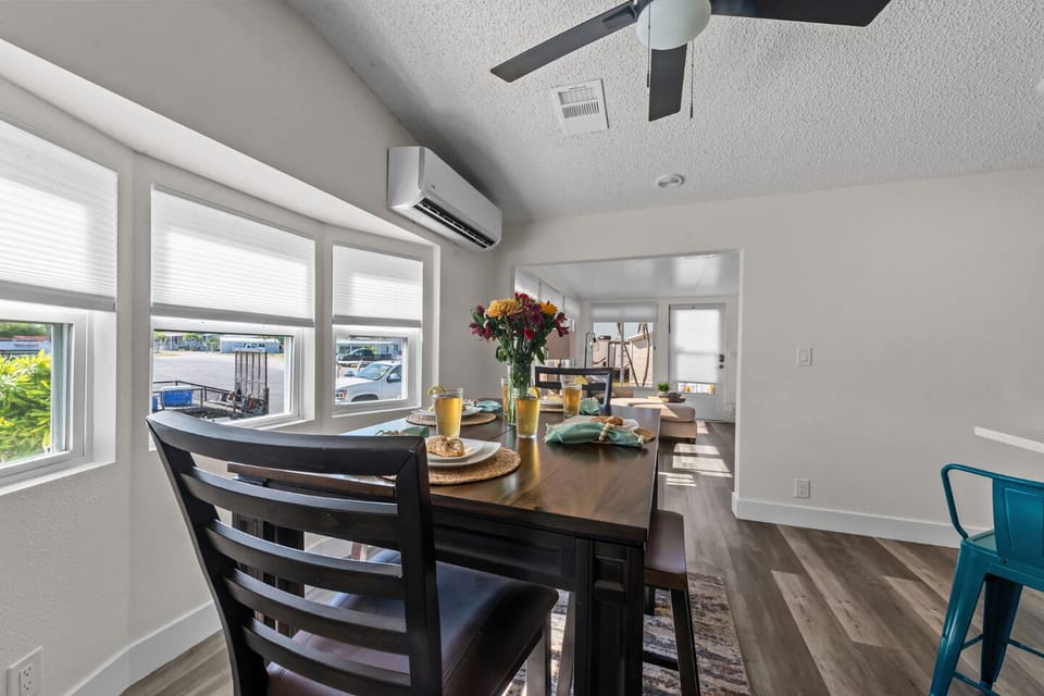 Enjoy meals together in this light-filled space with colorful decor and ample seating.