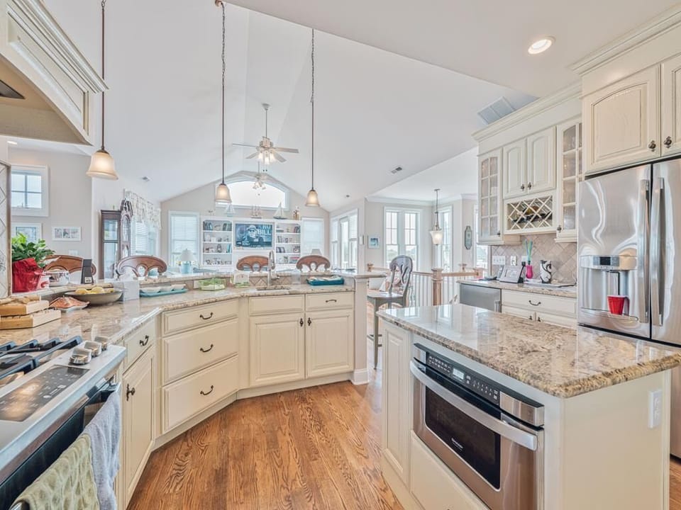 Stunning gourmet kitchen with granite countertops, high-end appliances, and a spacious island for meal prep.