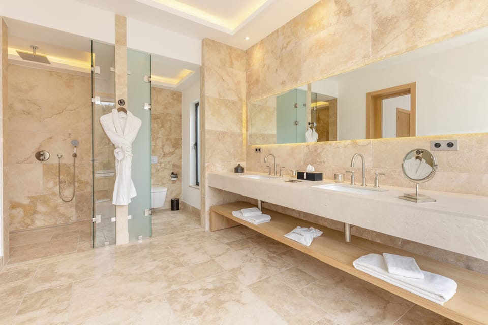 Ksara Large Suite | Bathroom | Separate tub and shower, designer toiletries, hair dryer, bathrobes