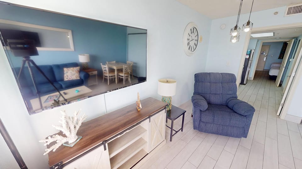 Spacious living area designed for relaxation after a day at the beach, perfect for movie nights or unwinding with family and friends.
