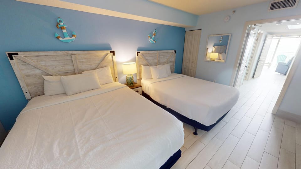 Relax in the comfortable bedroom a peaceful atmosphere for restful nights after fun days along the shore.