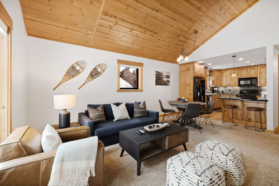 Newly redecorated living area with vaulted ceilings